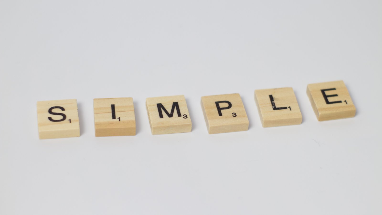 scrabble pieces spelling "simple"